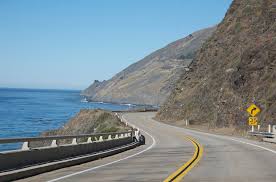 <h2> 1) Pacific Coast Highway in California </h2>

We saved the best for last. Soak up the sun along one of the most famous ocean drives in the world. A more than 600-mile journey takes you through beautiful destinations like San Diego, Los Angeles, Big Sur, Monterey, and San Francisco. Widely renowned as one of the most beautiful motorcycle roads in America, the PCH hugs tall rugged cliffs on California’s coastline. Experience sheer drop-offs, hairpin turns, sparkling blue ocean, and often even heavy morning fog on this narrow two-lane highway. Highway 1 has both challenging stretches that keeps riders on their toes and more relaxed areas that feel like easy ridin'. Ride through ancient coastal redwood forest and hear the crash of waves as you check this ride off your bucket list.